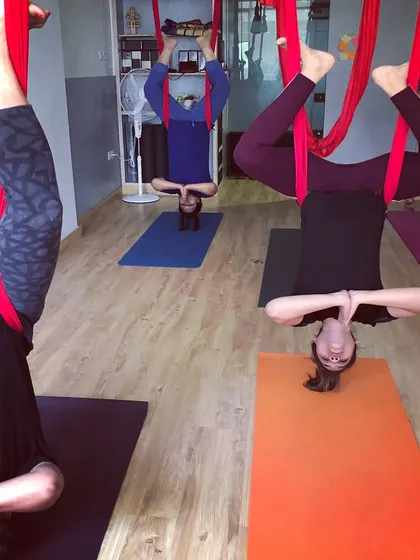 A private group session in full swing with everyone enjoying an inversion. This is a great idea for a healthy and memorable get together.