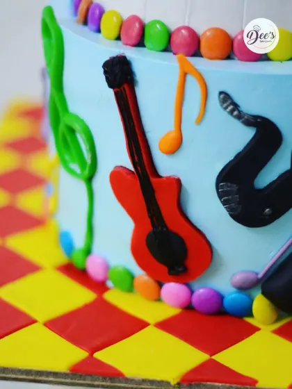 The edible guitar and other musical symbols are all handcrafted from fondant.