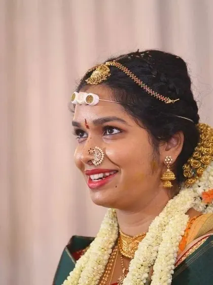 There's nothing more rewarding than seeing a bride's happy smile. This candid shot captures the joy and radiance of a bride on her big day, a look we created together to feel natural and beautiful.