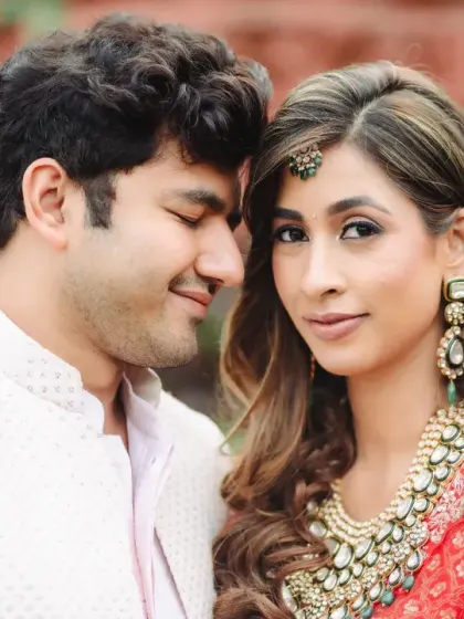 A serene and elegant portrait of a newly married couple. Their soft expressions and gentle touch convey a deep sense of love and connection.