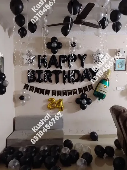 A black and silver themed birthday setup, perfect for a stylish celebration.