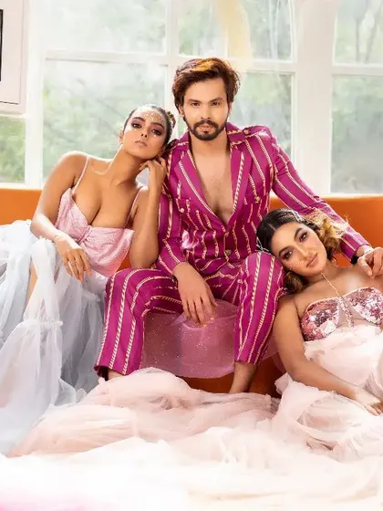 A high-fashion group shot featuring two female models and one male model. I excel at creating powerful group compositions that tell a brand's story, as seen in this promotional image for the Bangalore Couture Edition.