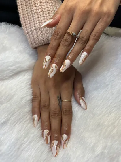 Another example of excellent student work. This white and gold marble design shows their command of texture and color blending.