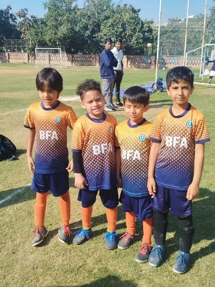 Four members of our Under 7 team, standing together. The friendships they build are as important as the skills they learn.