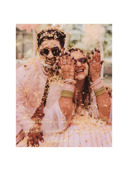 Presenting the golden couple, painted in sunshine. This shot of the couple covered in petals and haldi, hiding their faces playfully, is an iconic memory.