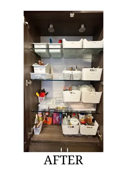 After: The same art supply cabinet, now perfectly organized with white bins. We categorized everything, making the space functional and inspiring.