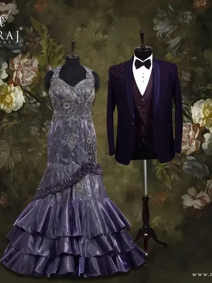 A magical combination of color and form. The groom's purple suit with its floral vest and the bride's ruffled lavender gown create a look that is both elegant and unforgettable.
