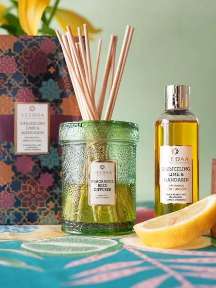 Our Darjeeling Lime & Mandarin reed diffuser set. The zesty, citrus fragrance is perfect for energizing a space, and the green hand-cut glass jar is a beautiful decorative accent.