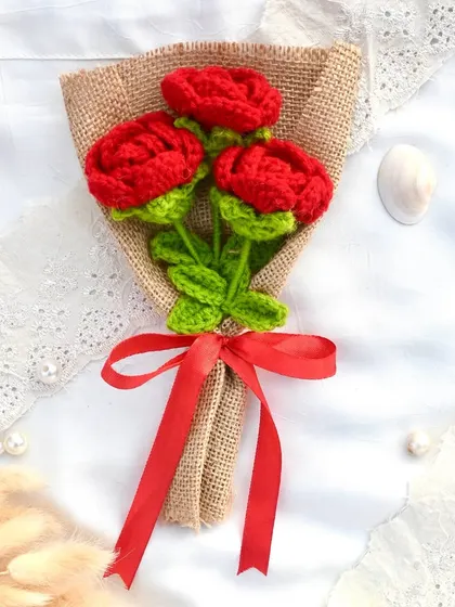 A classic gesture of love. This bouquet of three handmade red crochet roses is tied with a simple red ribbon, perfect for any romantic occasion.