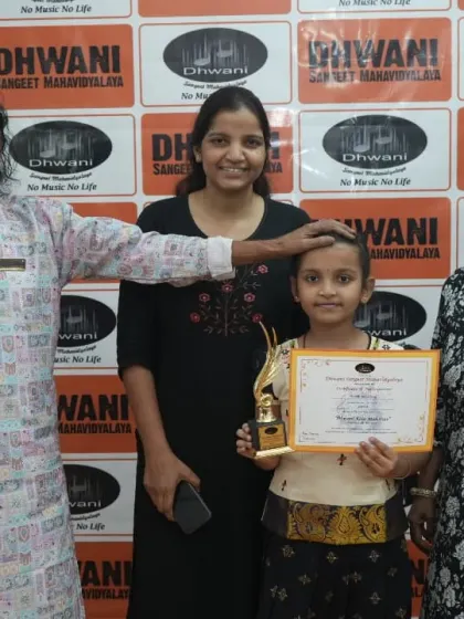 A student with her family and guru, a moment of blessing.