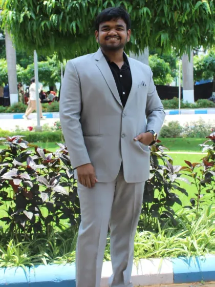 A student looking dapper in a light grey suit for his graduation day. I offer a wide range of formal suits perfect for such milestone events.