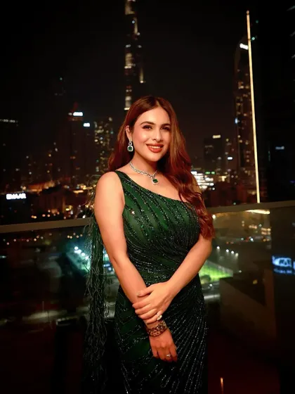 A glitter and glam look I styled for Neha Malik for an event in Dubai. This emerald green sequin gown with a dramatic train was perfect for a night out, set against the stunning backdrop of the Burj Khalifa.