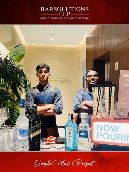Our team at the Kohler Studio Store launch in Pune, with a lineup of premium spirits like Grey Goose and Bombay Sapphire ready to be served.
