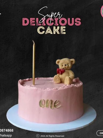 A sweet and simple cake for a first birthday. This lovely pink cake is topped with an adorable teddy bear and a single elegant candle, with "one" written in gold script.