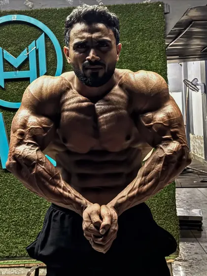Most muscular pose, showing the arm and chest vascularity.