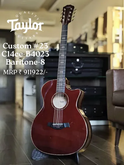 A truly unique instrument, the Taylor Custom #23 C14ce Baritone-8. This guitar offers a deep, resonant baritone voice with an added octave pair on the third and fourth strings for a rich, shimmering texture.
