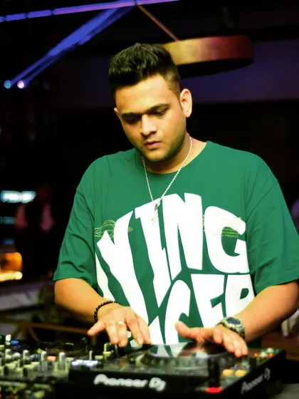 A close up showing my hands on the jog wheel and mixer. This highlights the hands on, active approach I take to DJing.