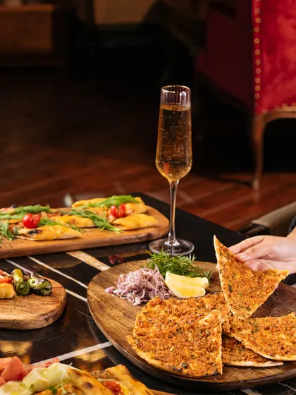 I offer a culinary journey through Turkey. Here, our Lahmacun, a thin and crispy Turkish pizza, is ready to be enjoyed alongside other regional delights.