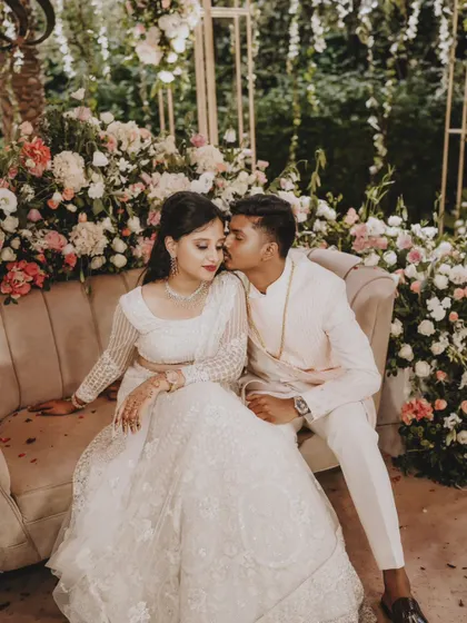 A sweet kiss from the groom, a lovely candid moment from the engagement day.