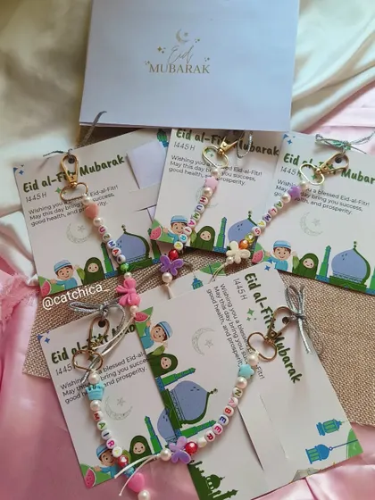 A batch of our beaded name keychains attached to Eidi Mubarak cards, ready to be gifted.