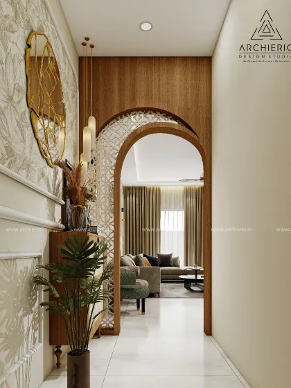 A grand entrance inspired by traditional Indian architecture. The carved wooden archway and intricate jali screen create a warm and elegant welcome, setting the tone for the home within.