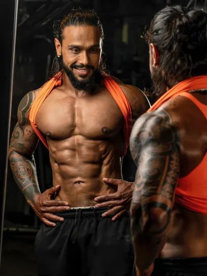 A confident look in the mirror, checking ab definition. This is a moment of recognition for the hard work put in. My programs are designed to get you to this point of satisfaction and pride.