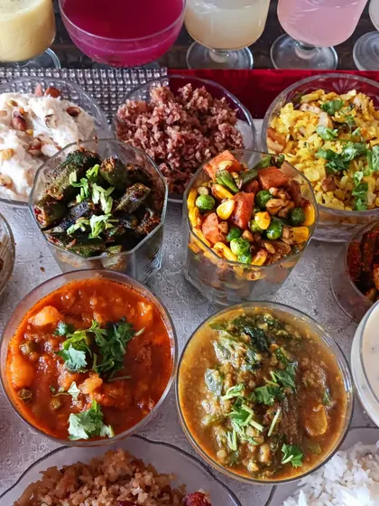 A selection of the vibrant vegetable dishes and curries from the 56 Bhog, showcasing the rich colours and textures of plant-based cooking.