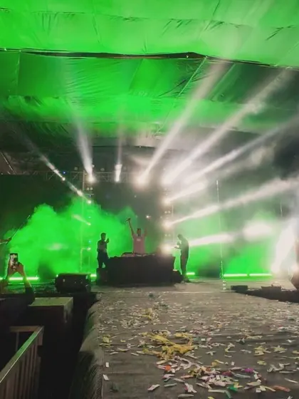 Throwback to an unforgettable night at Mount Carmel College. The stage setup with green lights, smoke, and confetti was absolutely epic.