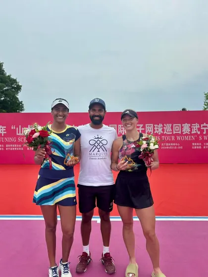 A photo of me with the doubles champions, Rutuja Bhosale and Paige Hourigan, at the W50 Wuning awards ceremony.