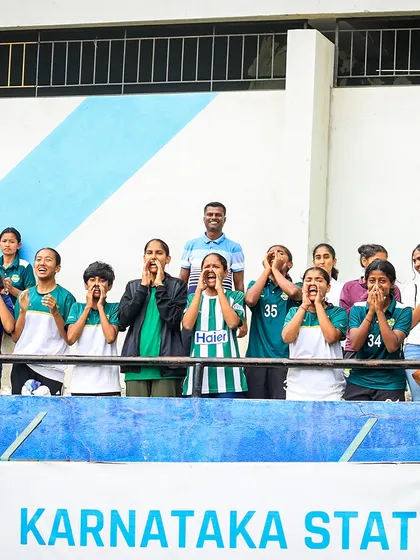 The twelfth man. Our young players in the stands, cheering passionately for their teammates on the pitch, creating an electric atmosphere.