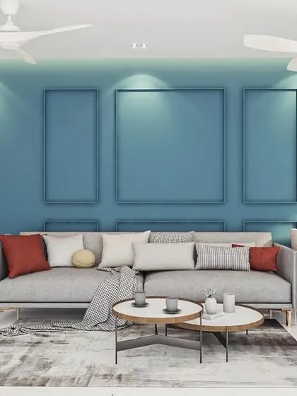 This view shows the full impact of the teal feature wall with its empty frames, a design choice that adds architectural interest without the need for art. The clean white cabinetry and sideboards offer ample storage, keeping the space uncluttered and minimalist.