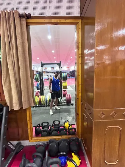 Another view of the training facility, showing the kettlebells and weight racks we use for our strength workouts.