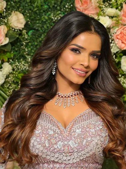 Want to look this pretty on your wedding day? We specialize in glamorous makeovers like this lilac look, perfect for a reception, ensuring you are the star of the show.