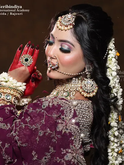 A back view of the hairstyle, showing the full length of the 'gajra' cascading down, a skill that adds immense value to bridal styling.