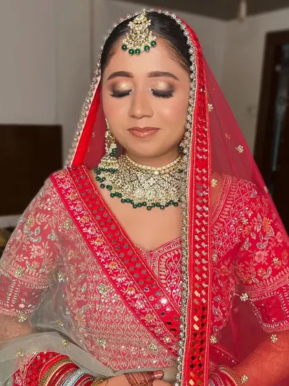 A view of the eye makeup with her eyes closed. The gold shimmer on the lid adds a touch of glamour without being overpowering, perfect for a traditional ceremony.