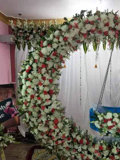 We also add fun, interactive elements to your event. For this naming ceremony, we included a personalized "Guess My Name" photo board for guests to enjoy, making the celebration even more special.