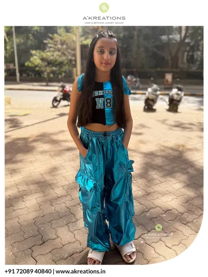Our young client looking confident and ready to perform in her cool outfit and professionally styled hair.