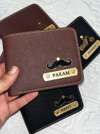 This brown wallet for "Param" also showcases the mustache charm. It's a great example of how a small custom detail can make a simple gift feel much more personal and thoughtful.