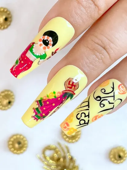 A close-up of the Gudi Padwa nails, focusing on the detailed painting of the Gudi and the festive script.