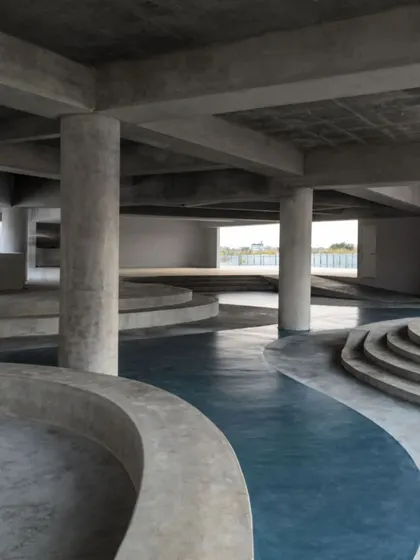 The informal seating area in the MSAP courtyard, with its curving concrete forms, provides a space for students to gather, relax, and exchange ideas.
