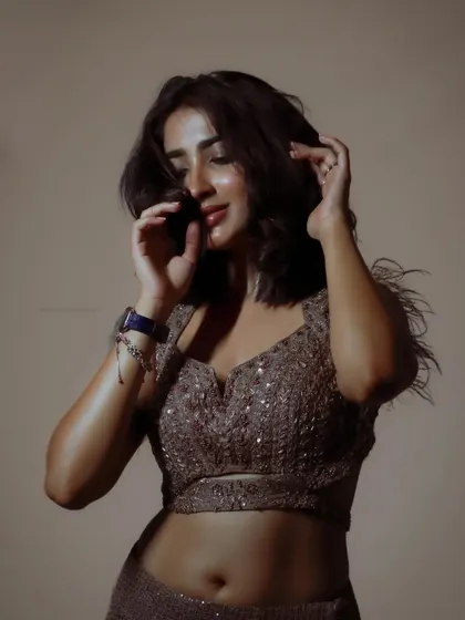 A candid, relaxed moment from the same shoot. This shows the model's natural personality.