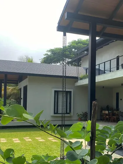 Grove House nearing completion, showing the relationship between the main house and the outbuildings.