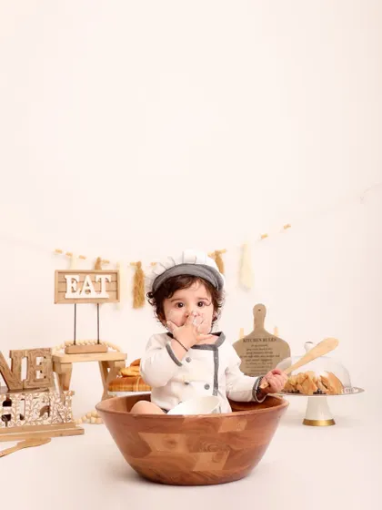 Taste-testing the ingredients! A funny and cute moment where the little chef has flour on his face while sitting in the mixing bowl. These are the memories you'll laugh about for years.