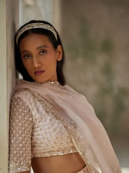 A beautiful shot of a model wearing our beaded hairband, perfect for a sophisticated look.