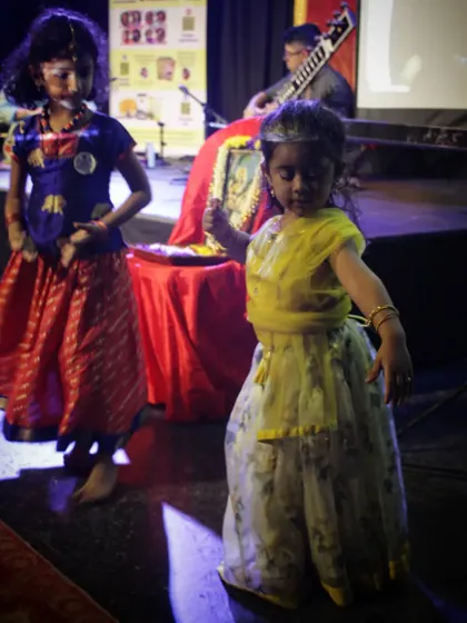 A divine moment on stage as two young girls begin to dance spontaneously to the music. This is the purest form of expression, a glimpse of the power of Indian classical music.