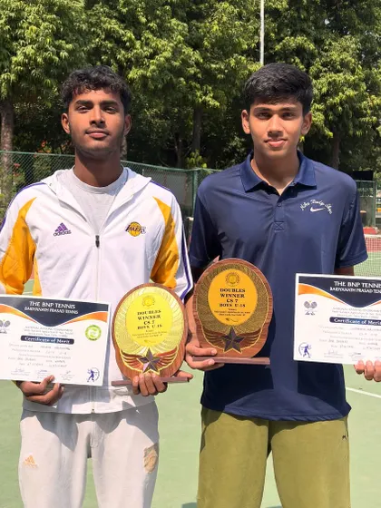 A closer look at the hardware. These trophies represent teamwork, strategy, and the will to win in doubles tennis.