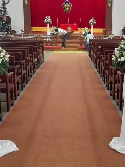 A classic and serene aisle decoration for a Christian wedding. We placed elegant floral stands with white lilies and roses along the aisle, leading up to the altar.