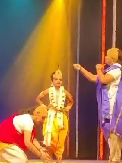 A theatrical moment from the dance drama, showcasing the use of 'abhinaya' or expression to convey a story.