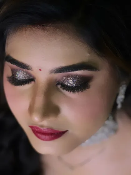 A close up of the perfect features of my reception bride. The glittery smokey eye is the star of this look.