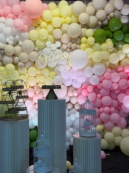 A beautiful pastel balloon wall with an "Oh Baby" neon sign. This versatile backdrop is perfect for baby showers, birthdays, or any chic celebration.